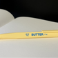Yellow square three sided pen made to look like butter