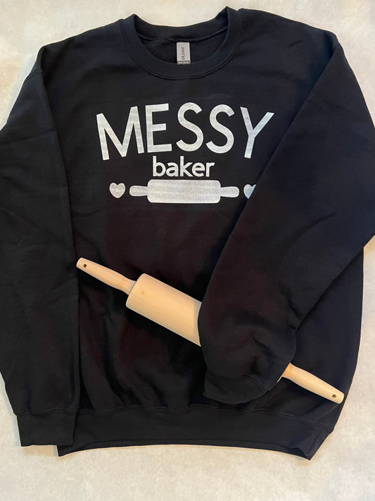 HELLO FELLOW MESSY BAKERS ! 
The kitchen may be in shambles but your cakes and cookies  look and taste AMAZING. EMBRACE IT with this Messy Baker crew neck sweatshirt